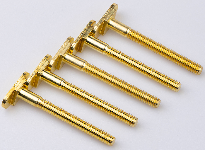 Six long brass screws with a shouldered shank on a white background
