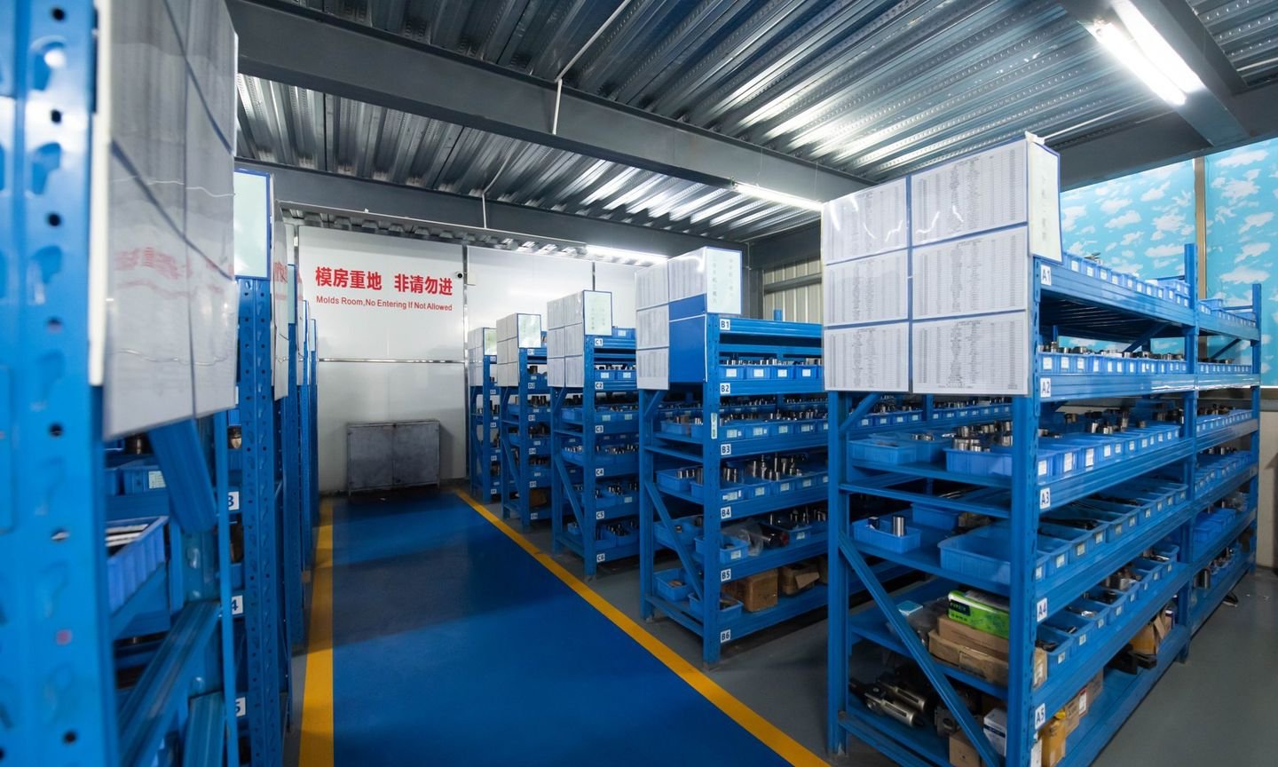 Rows of dies on blue racks in the TYF die room